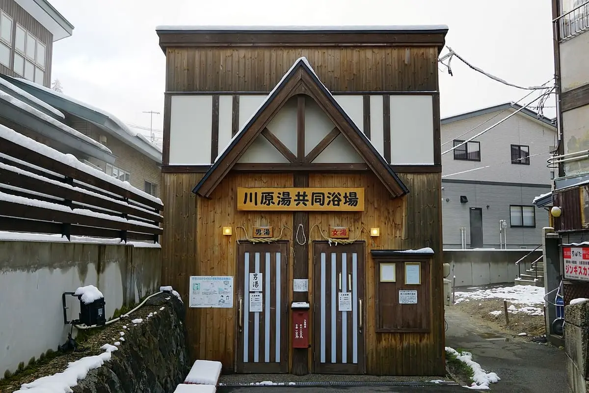 Wooden Kawarayu public bathhouse building in Zao Onsen