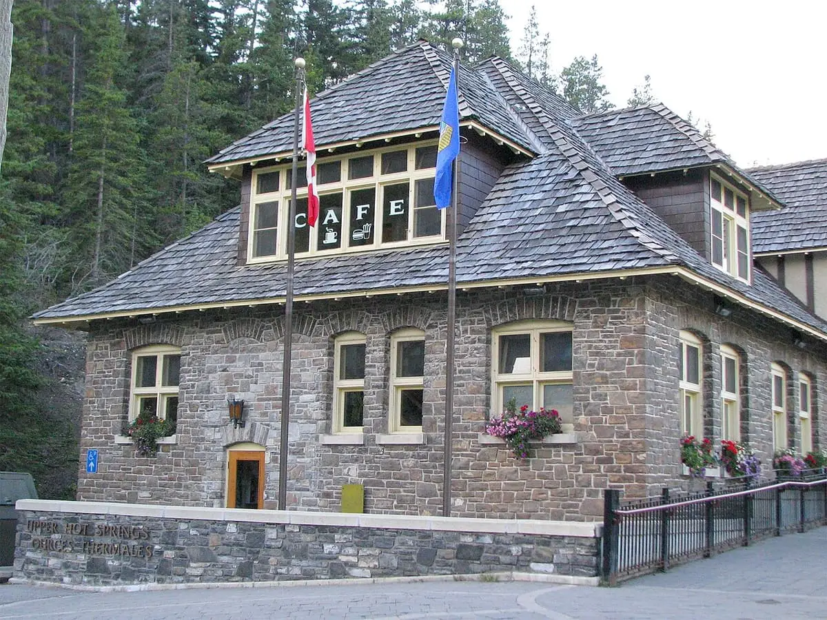 South end of the Banff Upper Hot Springs bathhouse, a stone building with a steep roof