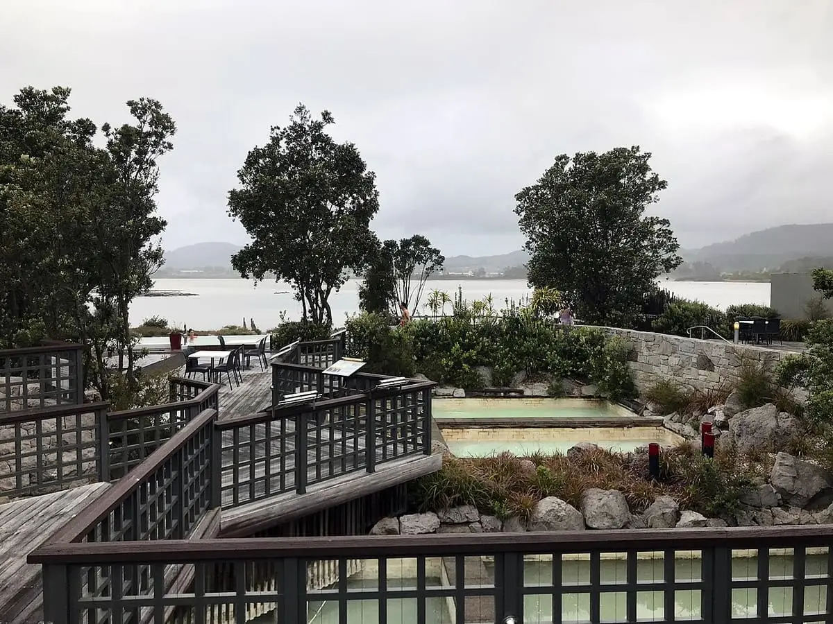 Terraced lakefront thermal pools and wooden boardwalks at Polynesian Spa beside Lake Rotorua
