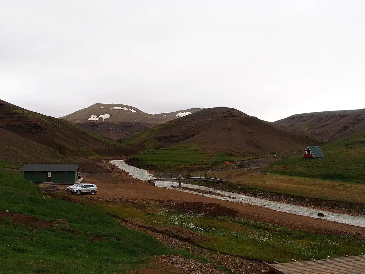 Cabins and a gravel track in Ásgarður valley below the Kerlingarfjöll mountains