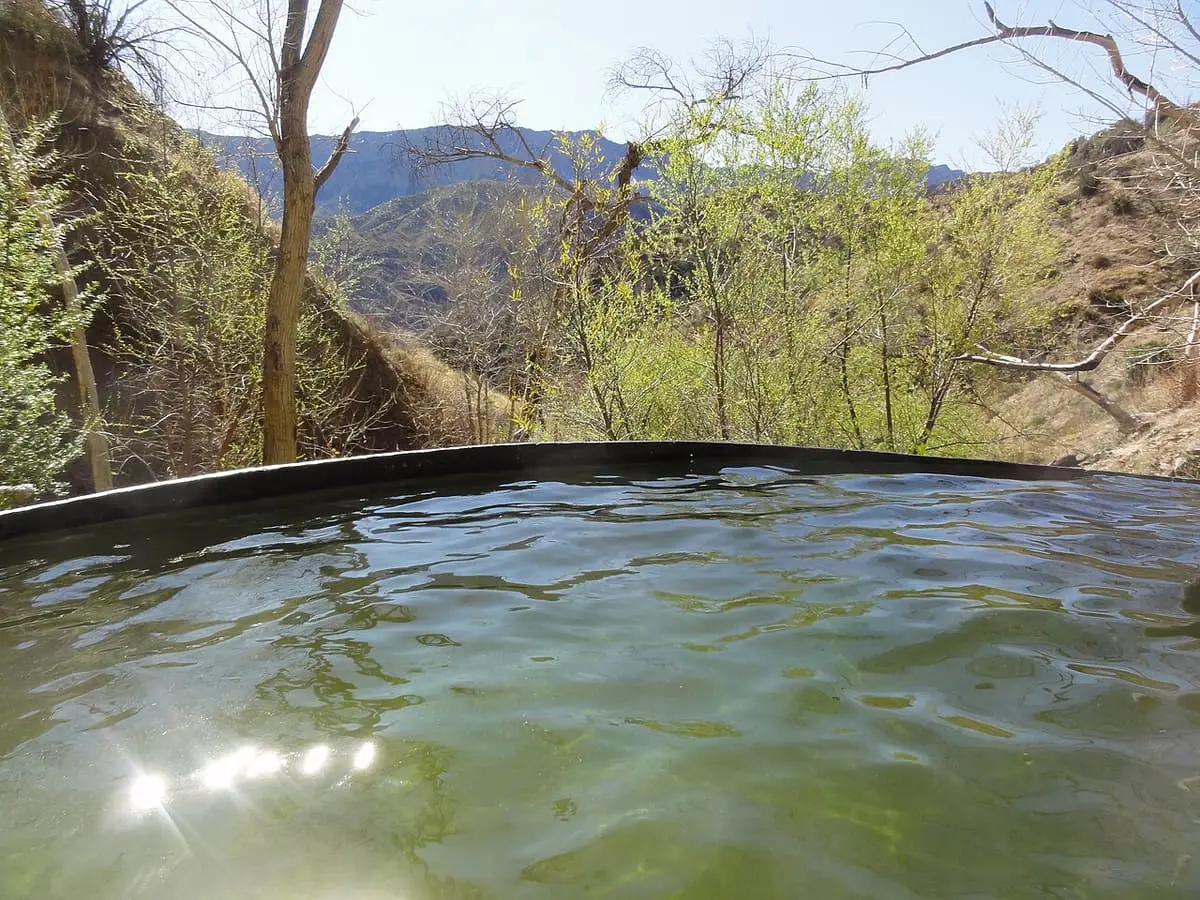 Sunlit water in the Willett Hot Springs tub looking out over the Sespe Wilderness hills