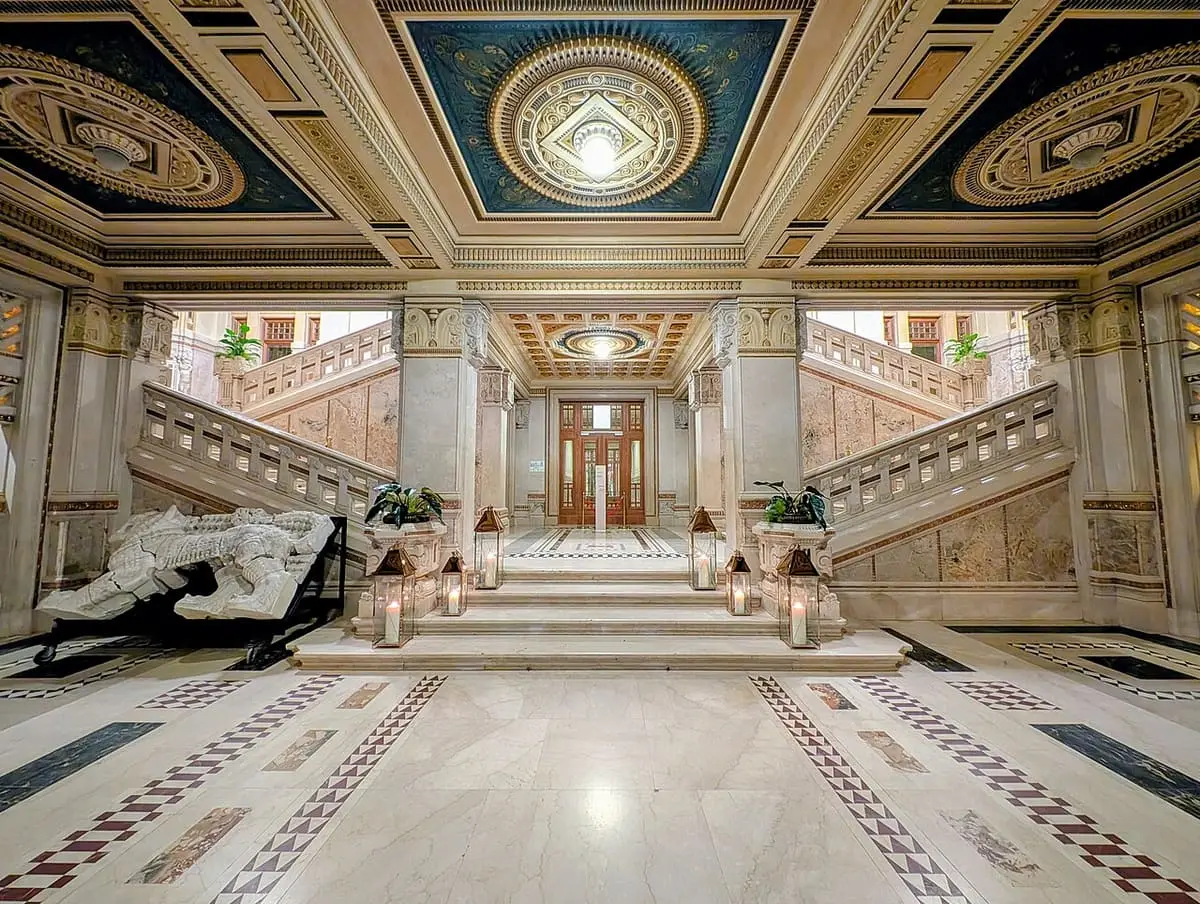 Marble entrance hall and double staircase inside the Terme Berzieri building