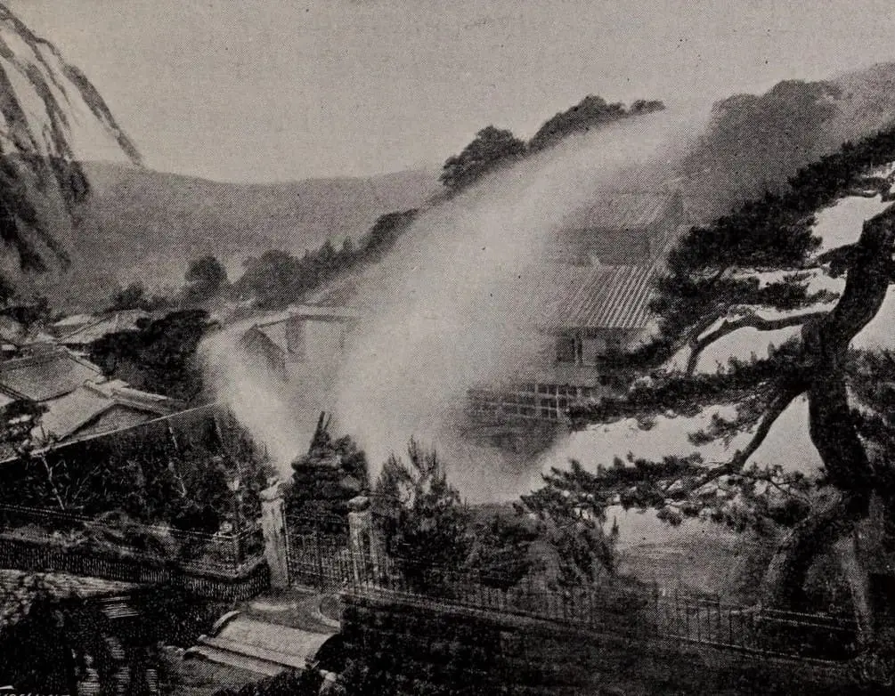 Historic black and white photo of the old Atami geyser sending up a column of steam