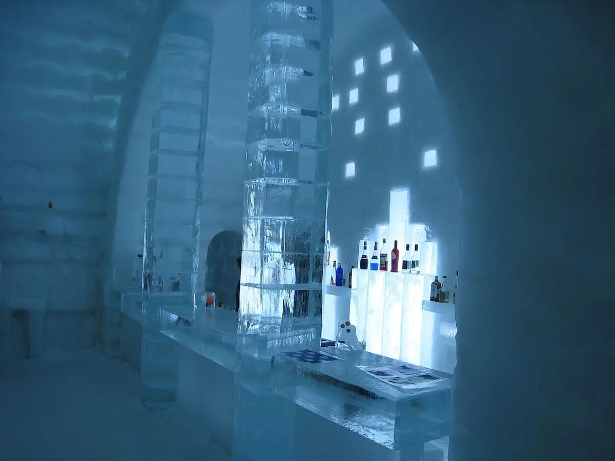Ice bar with ice pillars and glowing ice walls inside the Shikaribetsu ice village