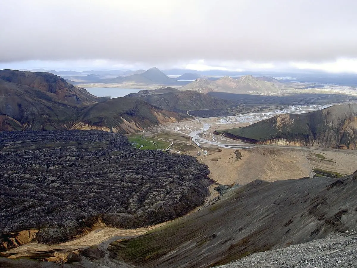 View over the Landmannalaugar area with dark lava fields and braided river plains