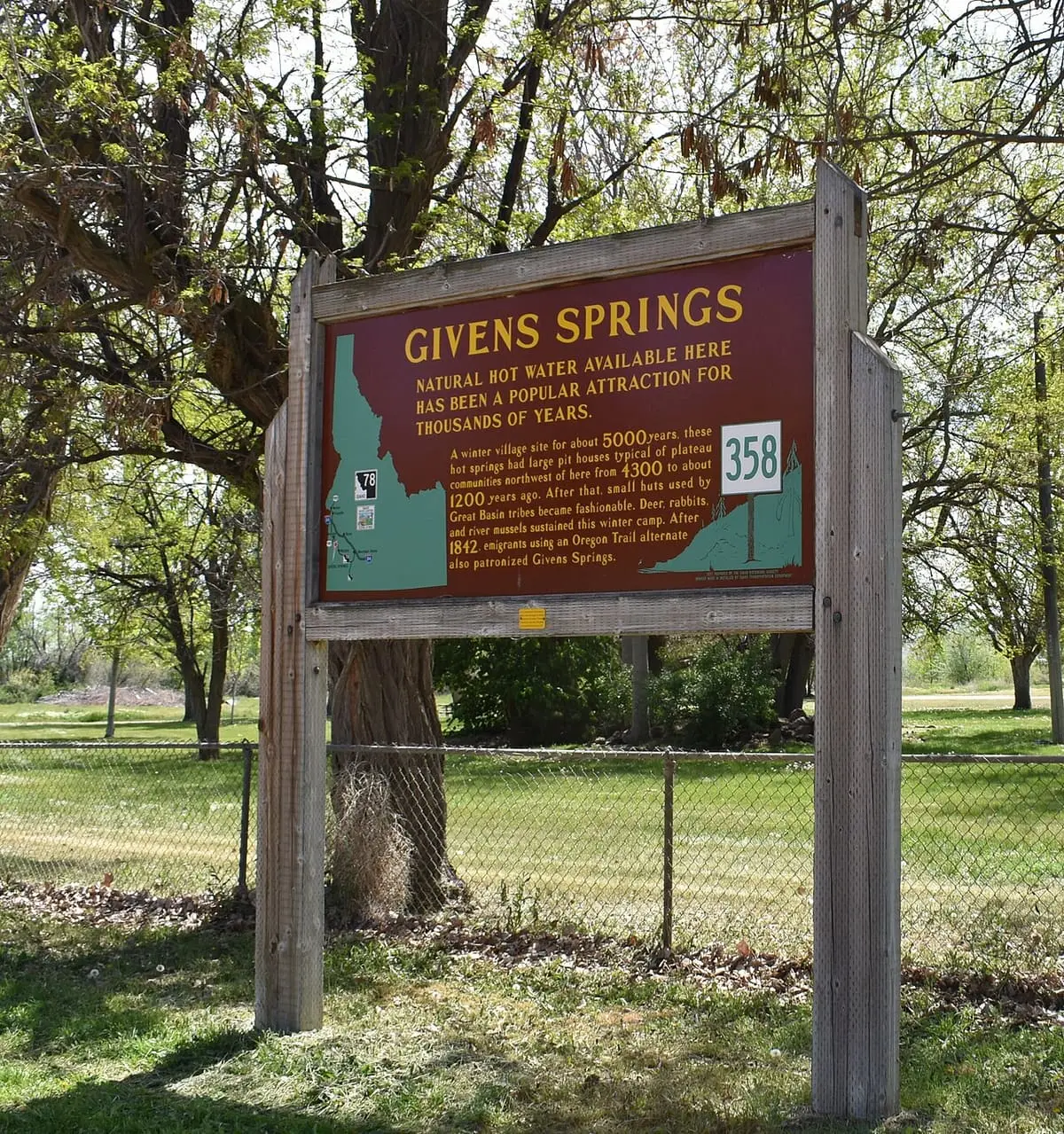 Idaho historical marker 358 for Givens Springs under cottonwood trees