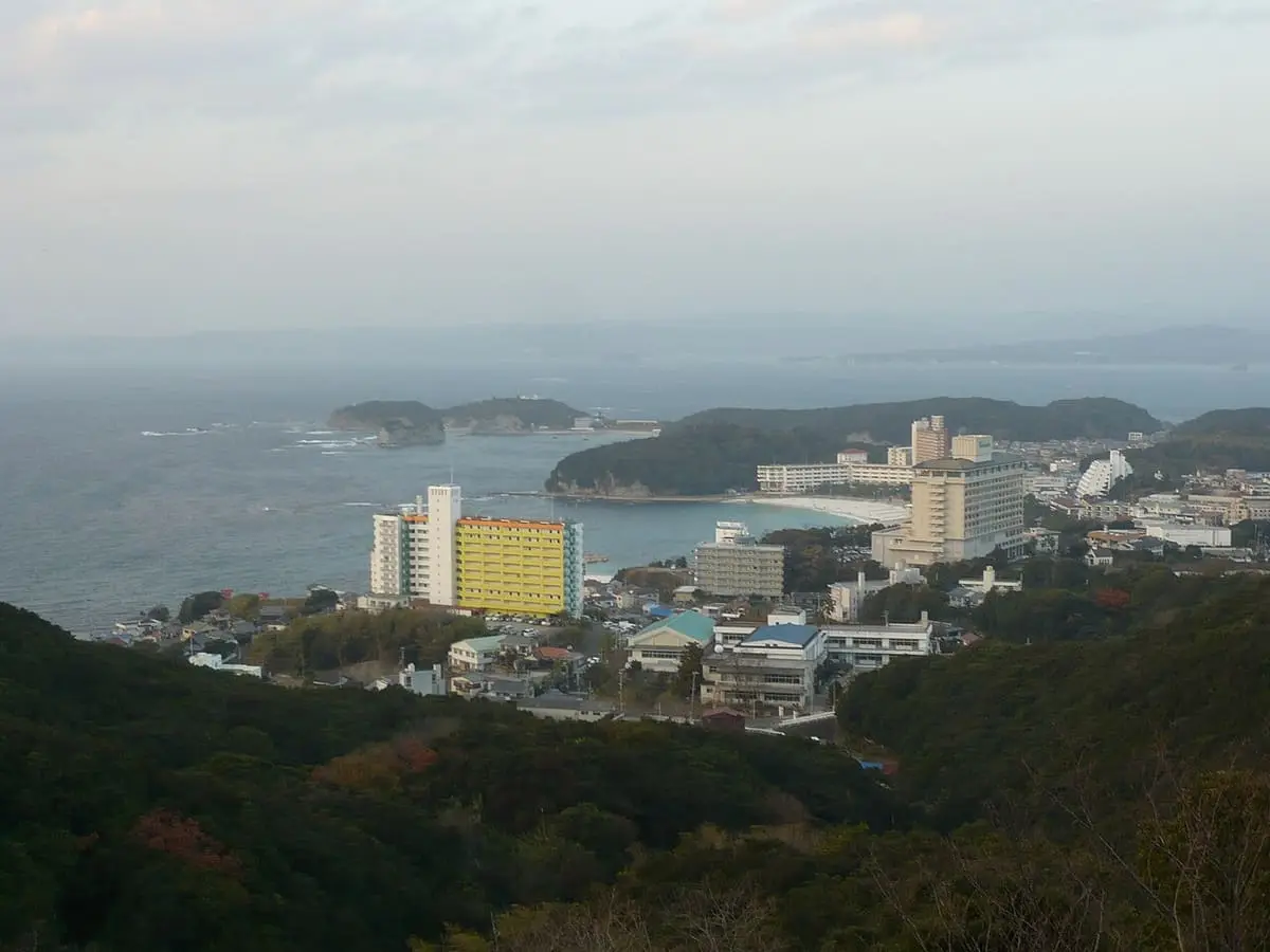 Shirahama Onsen town and hotels on a green headland above the Pacific coast