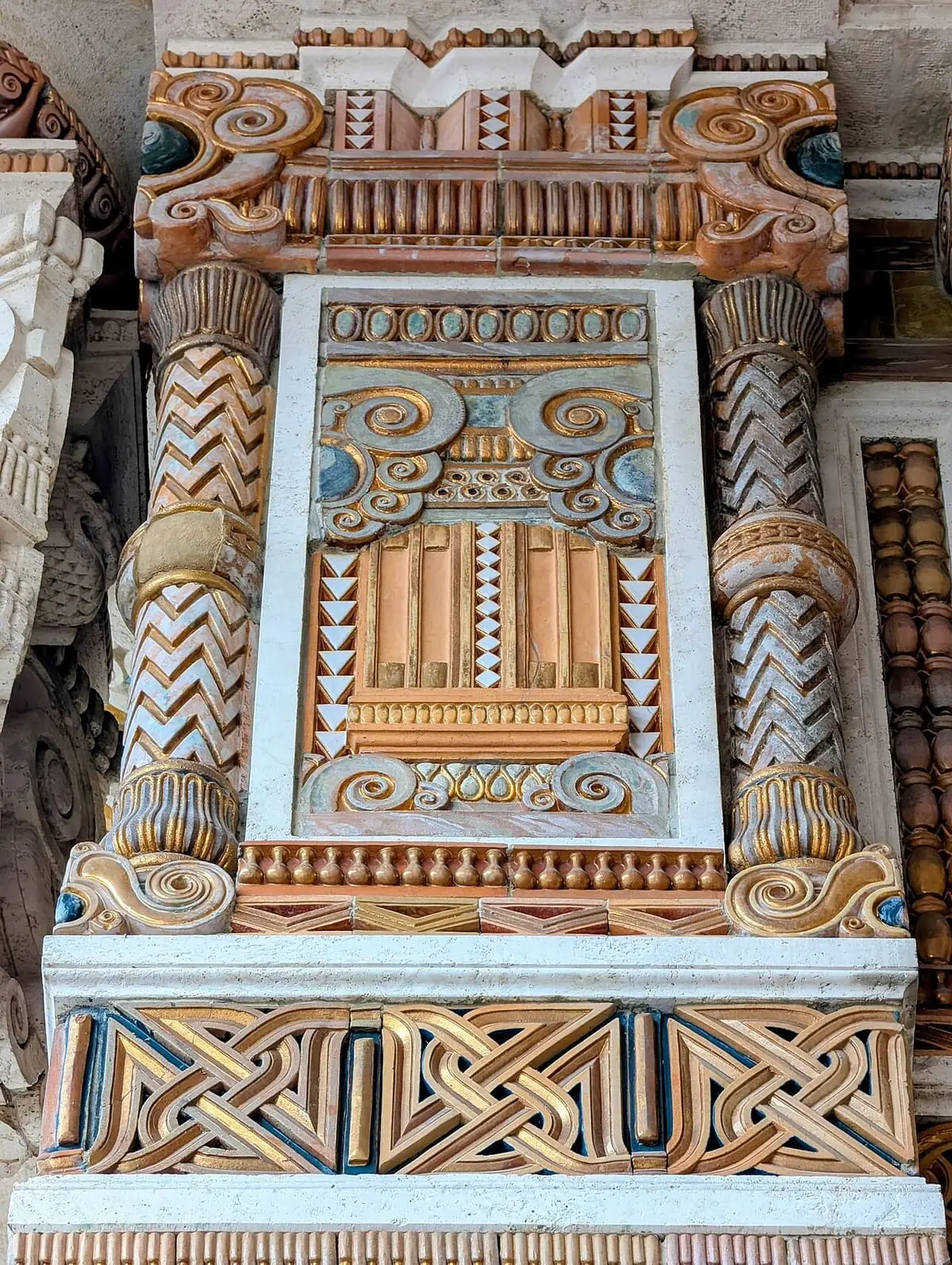 Colourful Art Deco ceramic decoration framing a doorway at the Terme Berzieri