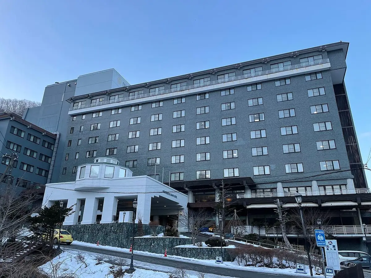 Noboribetsu Grand Hotel building under a blue winter sky