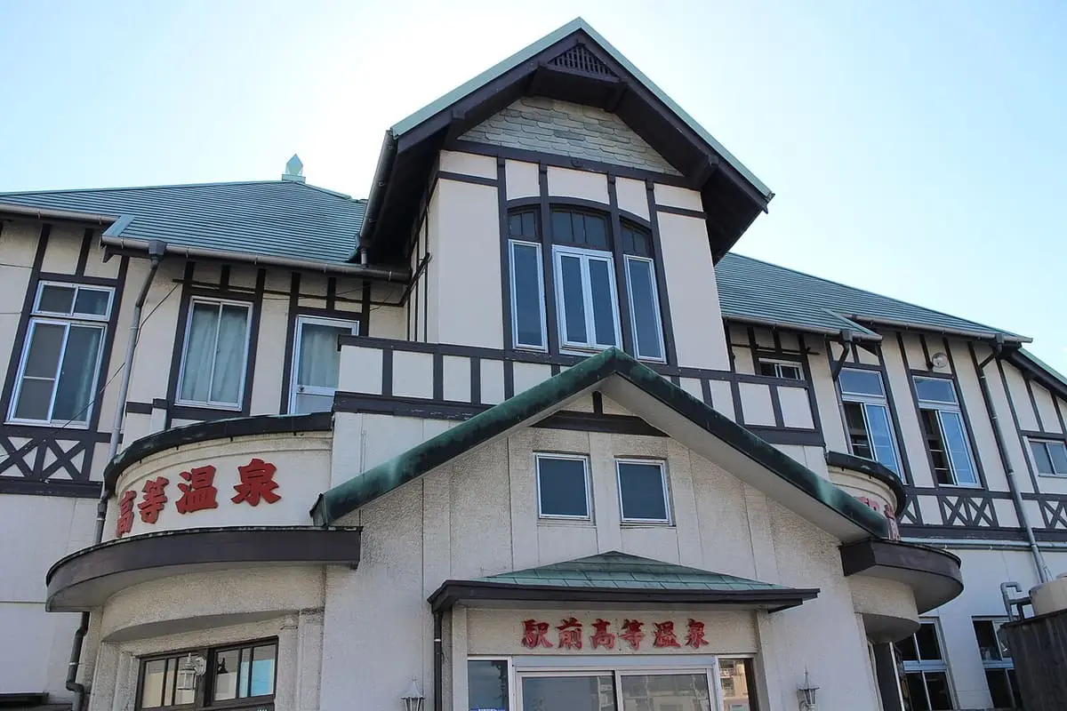 Half timbered facade of the historic Ekimae Koto Onsen public bathhouse in Beppu