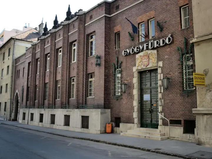 Red brick 1930 facade of the Dandár Thermal Bath with its Gyógyfürdő sign in Budapest