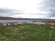 Reykjaskóli school buildings at Reykir on the shore of Hrútafjörður under a cloudy sky