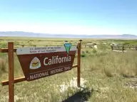 California National Historic Trail sign at Horseshoe Springs with marsh pools and Skull Valley beyond