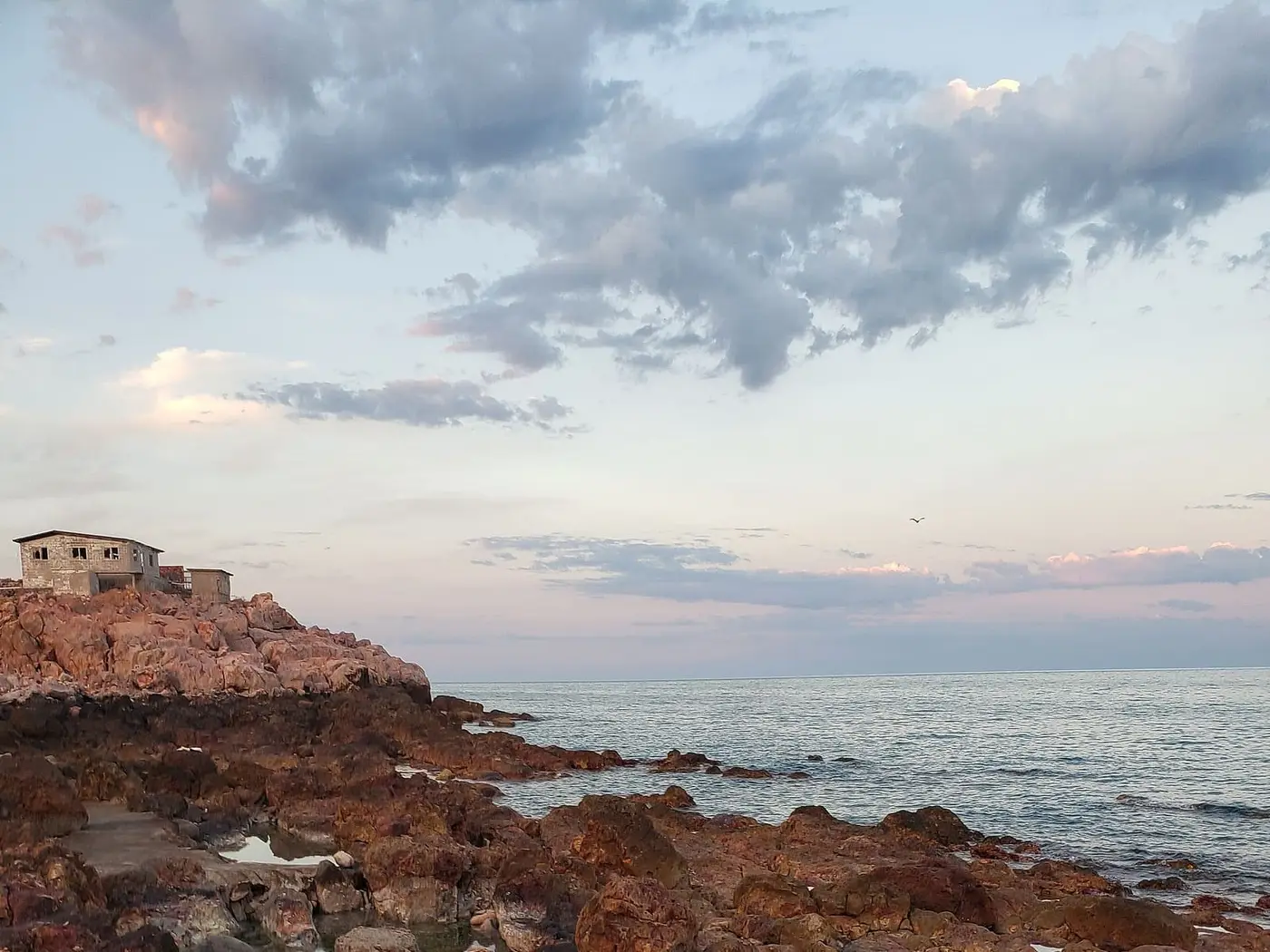 Rocky tide pools of hot spring water on the Sea of Cortez shore at Puertecitos