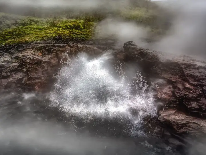 Boiling water splashing from Deildartunguhver hot spring, the source that feeds Krauma