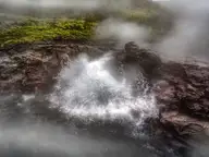 Boiling water splashing from Deildartunguhver hot spring, the source that feeds Krauma