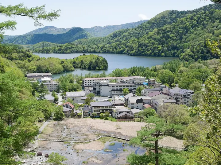 Okunikko Yumoto Onsen village and its steaming source field at the head of Lake Yunoko