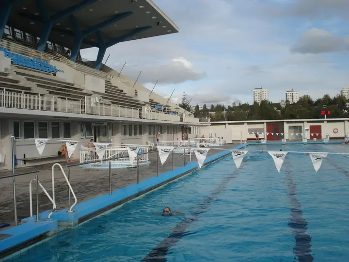 Laugardalslaug outdoor 50 m pool with lane ropes and the covered spectator stand