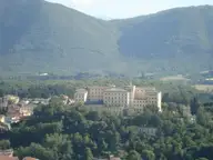 Large thermal complex building in Fiuggi among woods below forested hills