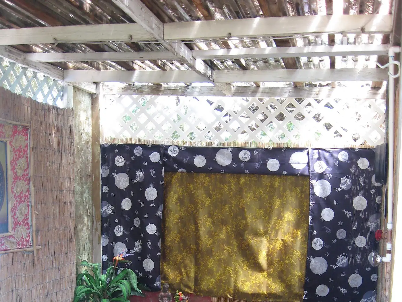 Private soaking tub room at Essence of Tranquility with a small rock fountain and dark mineral water