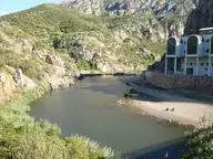 Coghinas river winding through a rocky gorge past the Casteldoria spa building