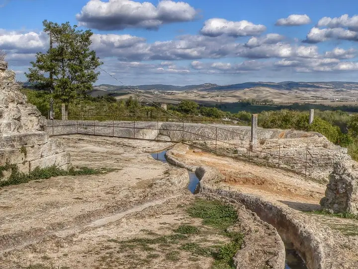 Travertine channels carrying thermal water across the Parco dei Mulini above the Val d'Orcia