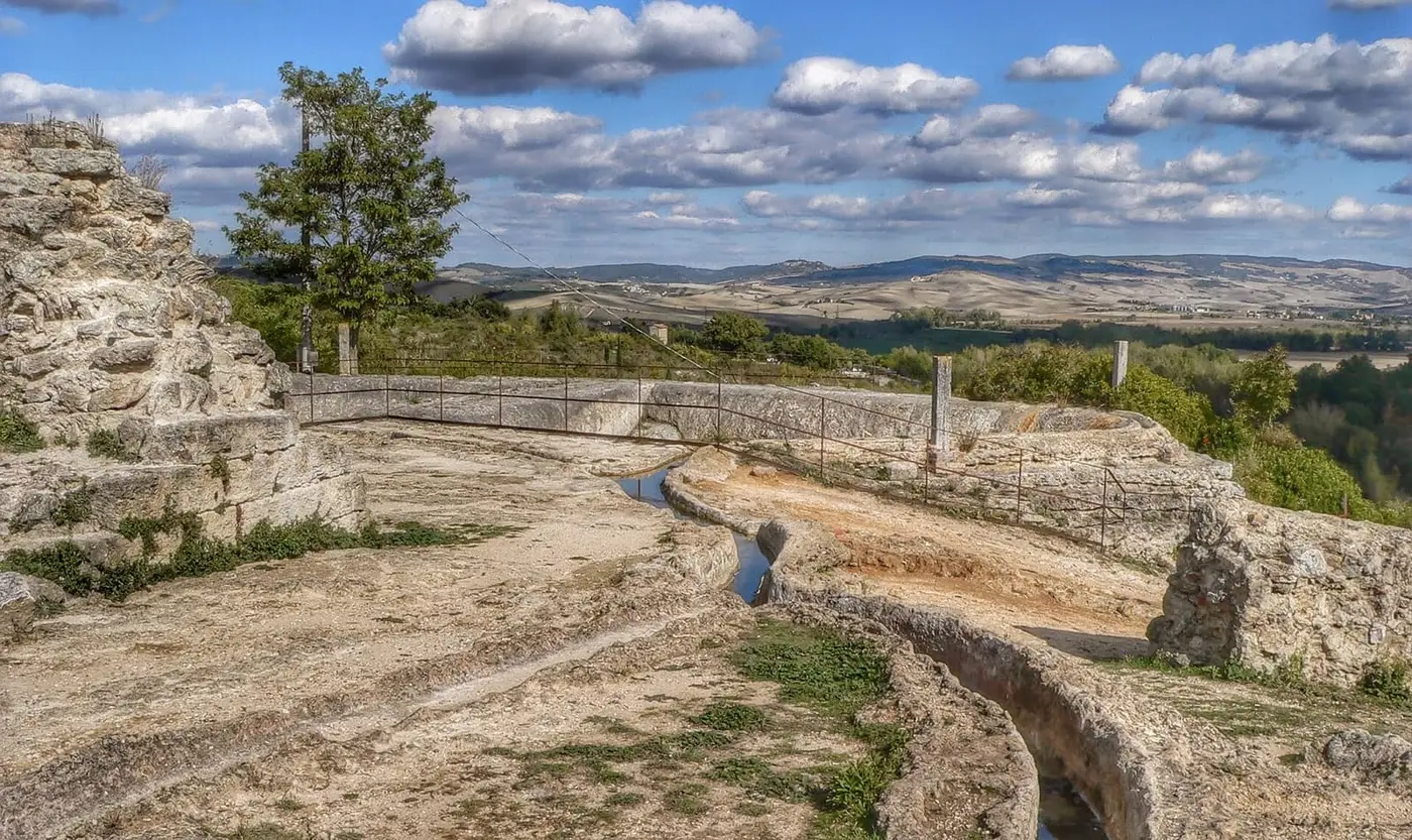 Travertine channels carrying thermal water across the Parco dei Mulini above the Val d'Orcia