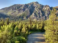 Middle Fork Boise River winding through pine forest below rugged peaks near Chattanooga Hot Springs