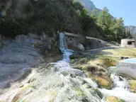 Hot sulphur water spilling over a small travertine waterfall at Thermopylae hot springs
