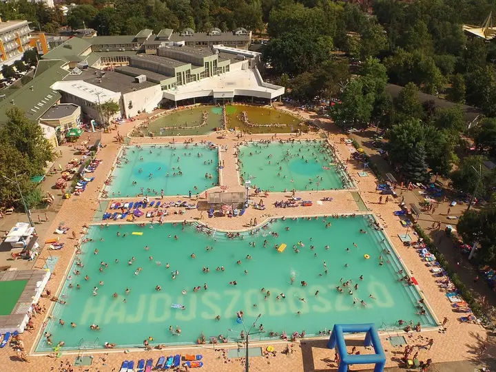 Aerial view of the large outdoor pools and buildings of the Hungarospa complex in Hajdúszoboszló