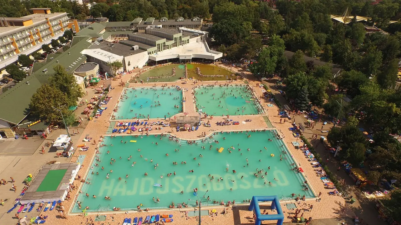 Aerial view of the large outdoor pools and buildings of the Hungarospa complex in Hajdúszoboszló