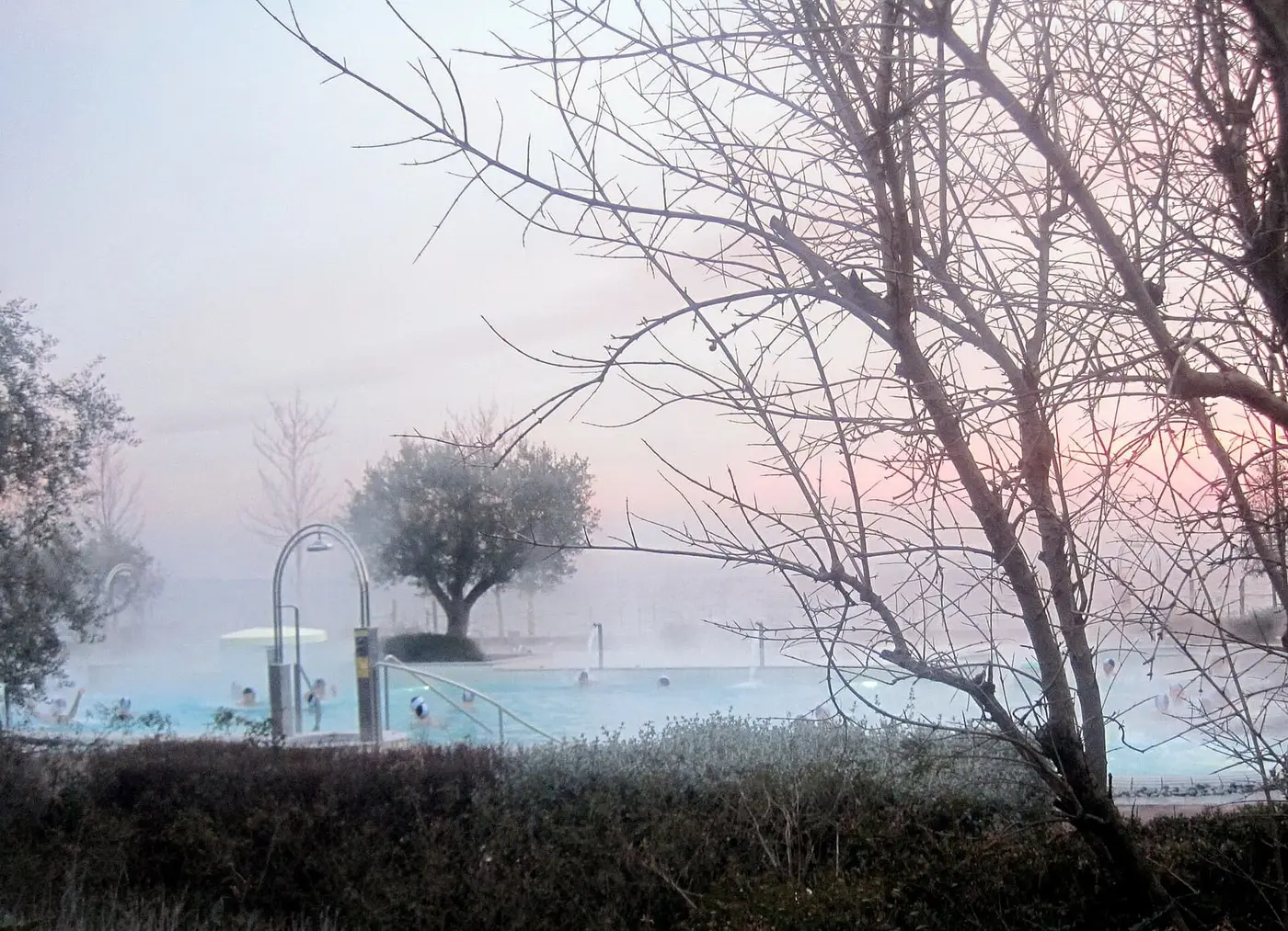 Steam rising from the outdoor thermal pool at Terme di Sirmione on a misty morning