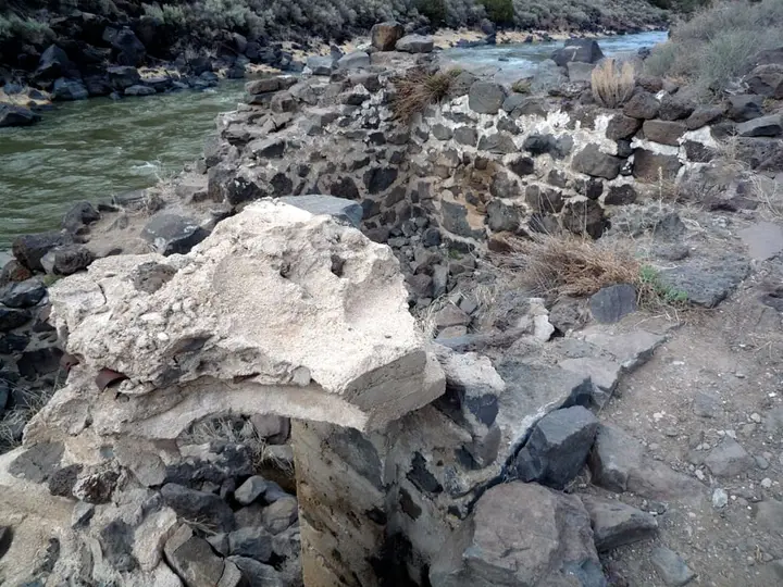 Stone ruins of the old Manby bathhouse on the bank of the Rio Grande in the gorge
