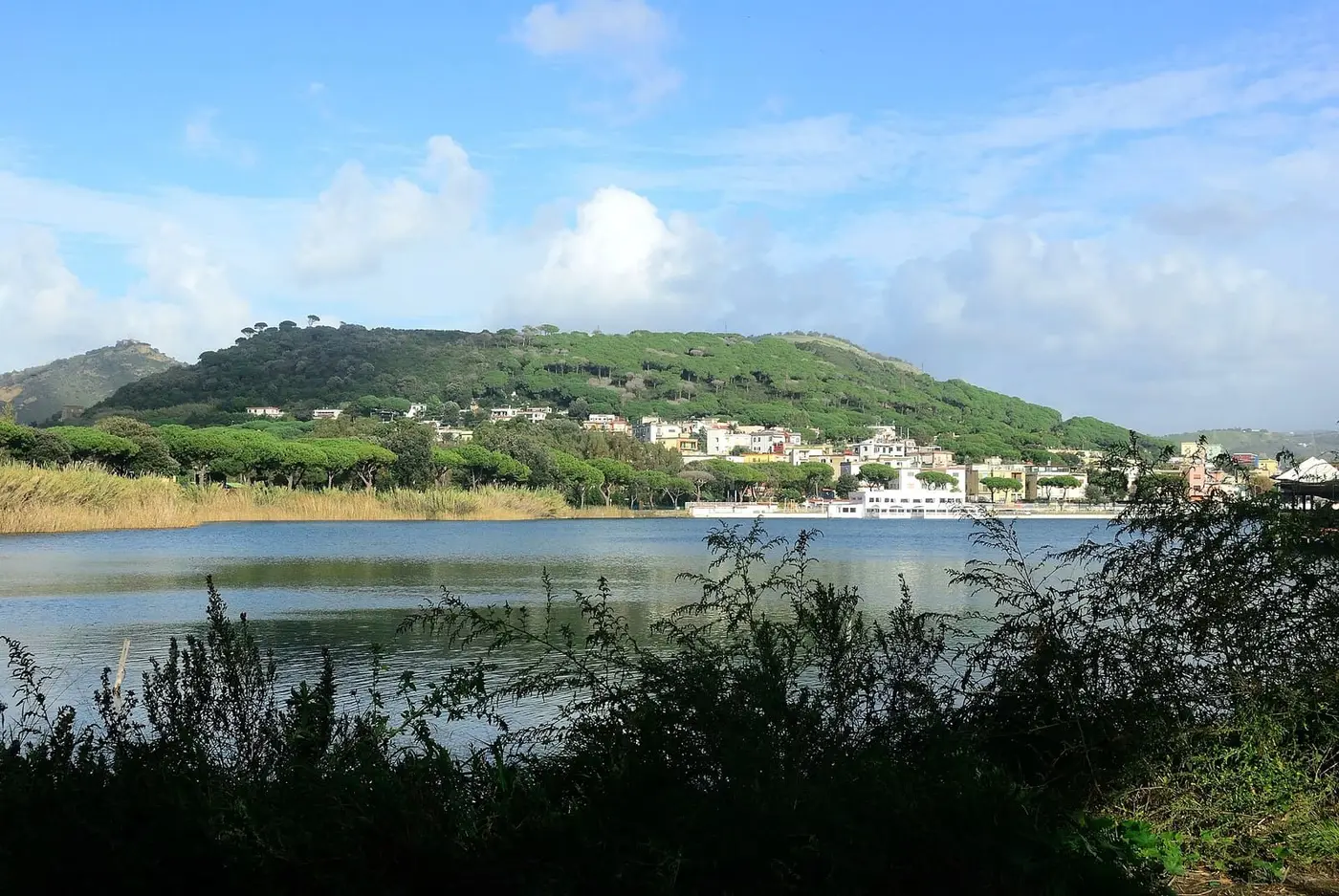 Lake Lucrino with the green cone of Monte Nuovo behind, below the Stufe di Nerone hillside